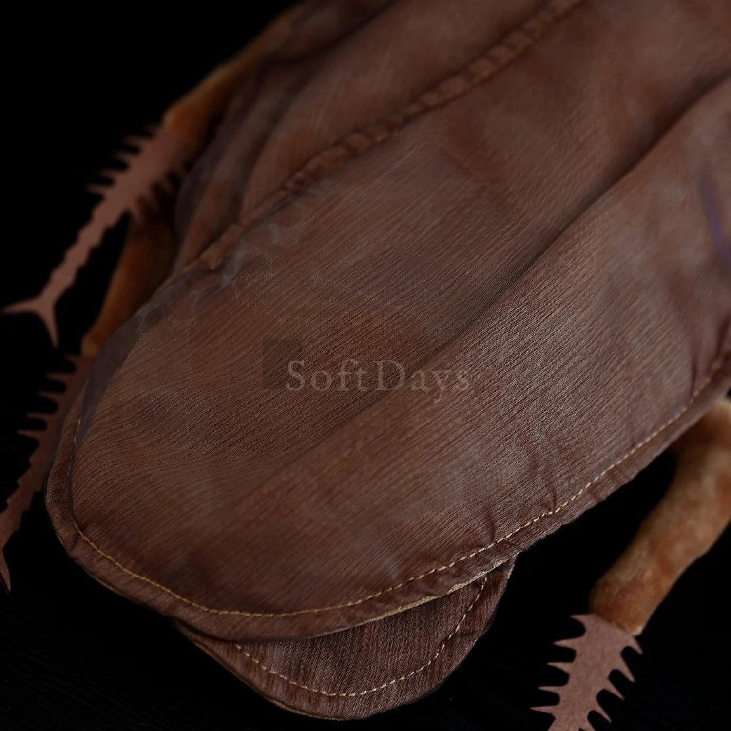 Close-up of the wing detail on the American cockroach plush, emphasizing its lifelike craftsmanship