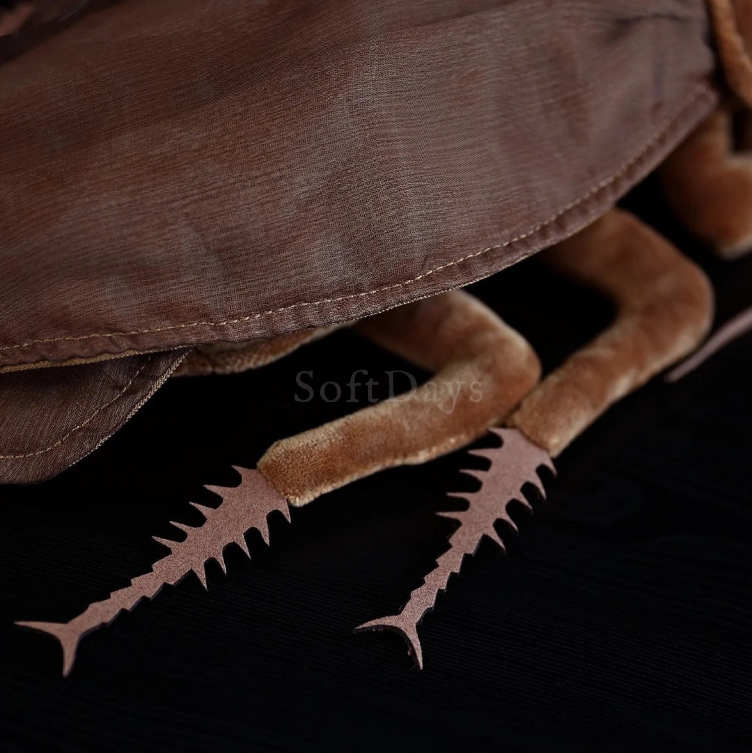 Close-up of the American cockroach plush legs, showcasing realistic spiked design and soft texture