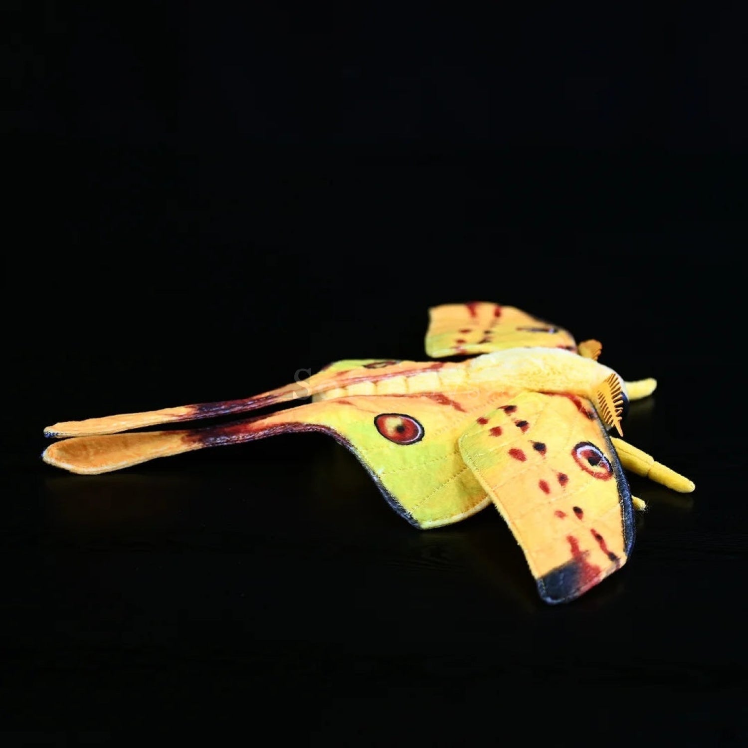 Lifelike Comet moth plush toy showcasing its long tail and vivid colors, perfect for nature and insect fans