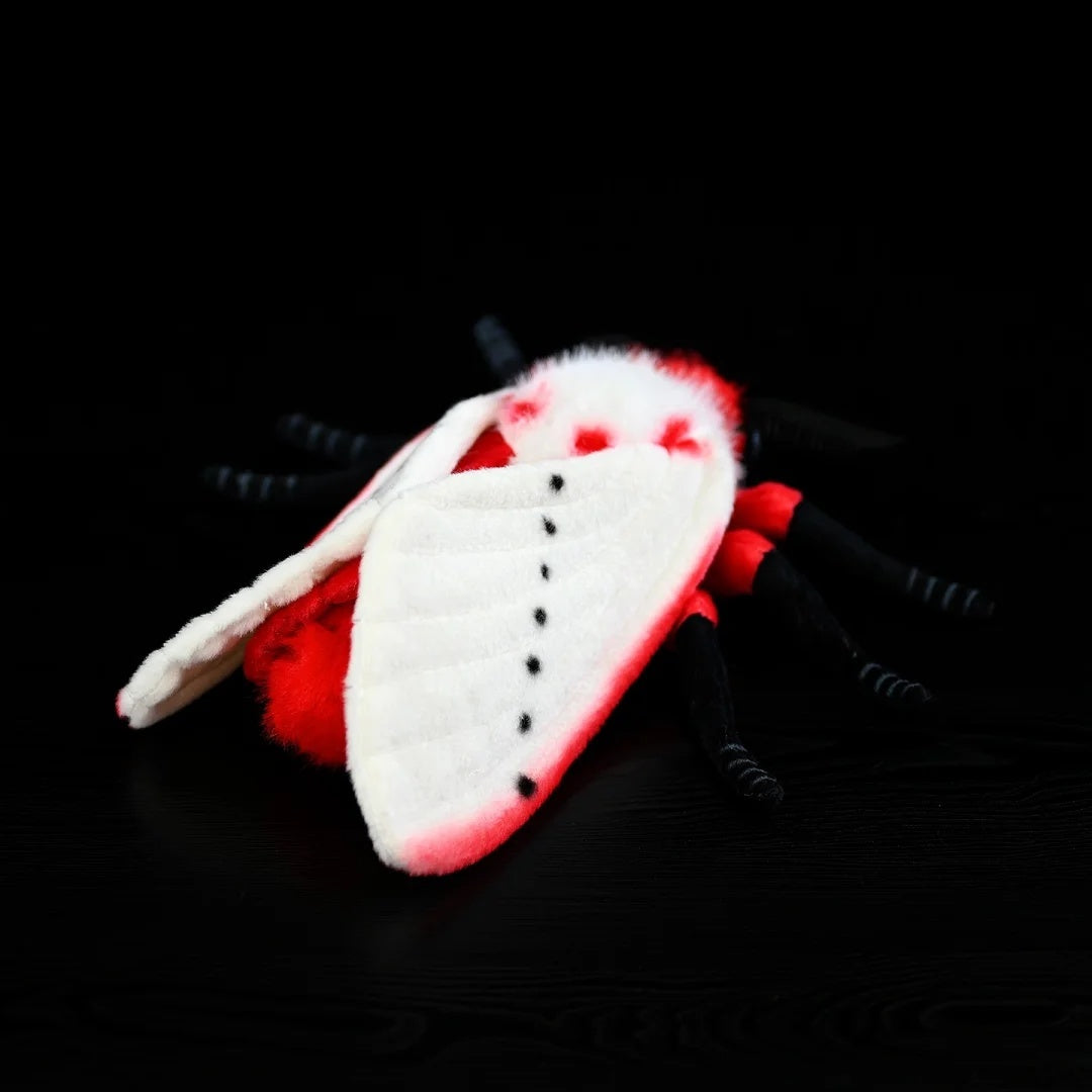 Back view of the Rosy Ermine Moth Plush by SoftDaysLab®, highlighting its realistic black-spotted wings and tropical moth-inspired look