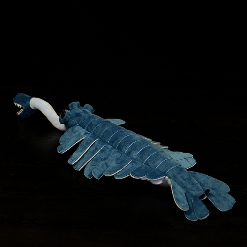Back angle view of the Opabinia plush toy, highlighting its segmented body and unique design