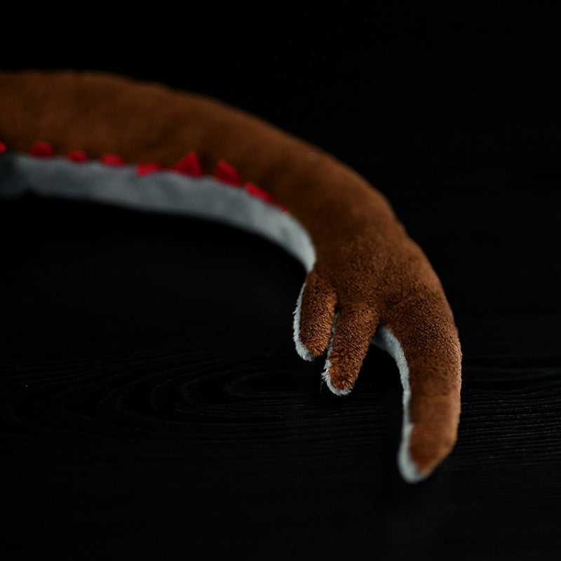 Close-up of the Omnidens plush toy’s talon-shaped appendage, showcasing intricate prehistoric details