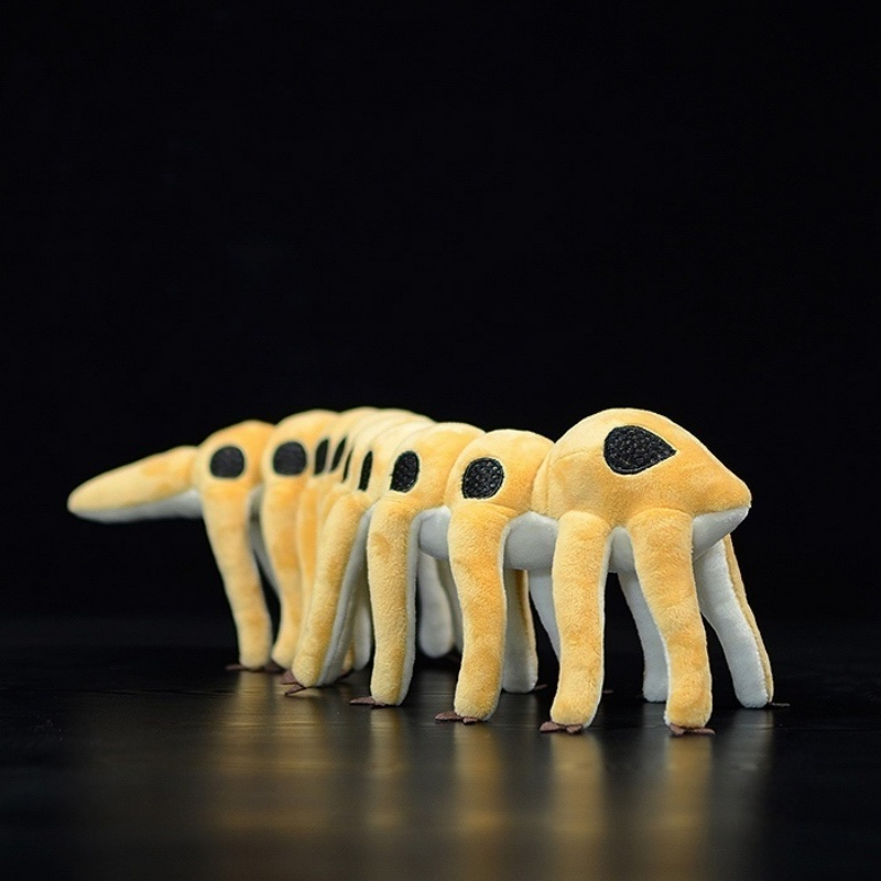 Angled view of the Microdictyon stuffed animal, highlighting its unique black armor plates and soft texture