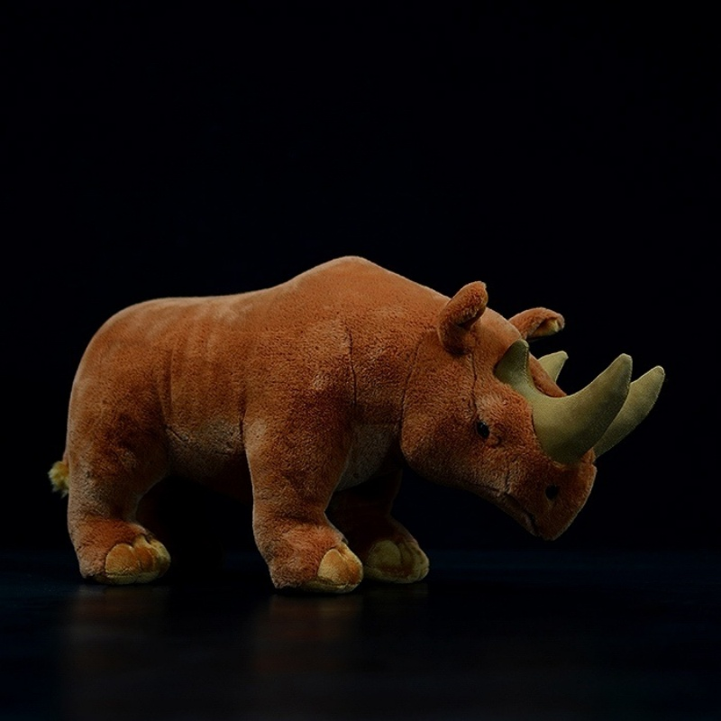 Side view of Arsinoitherium plush toy with realistic horns and soft fur by SoftDaysLab