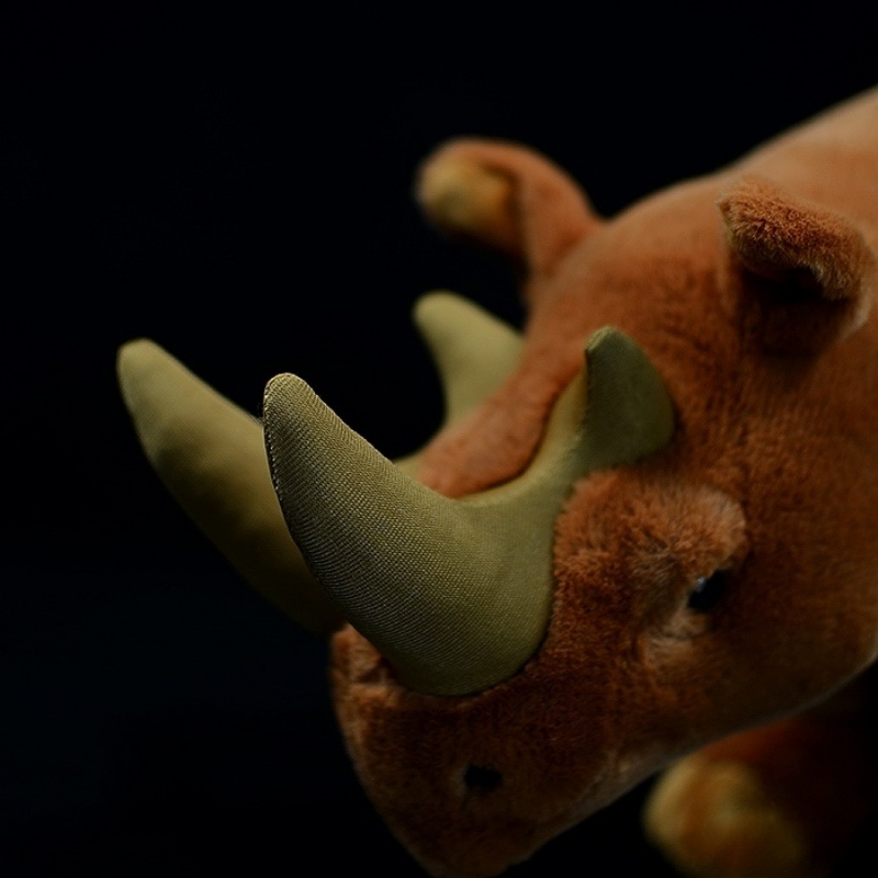Close-up of Arsinoitherium plush toy’s twin horns with soft, detailed texture