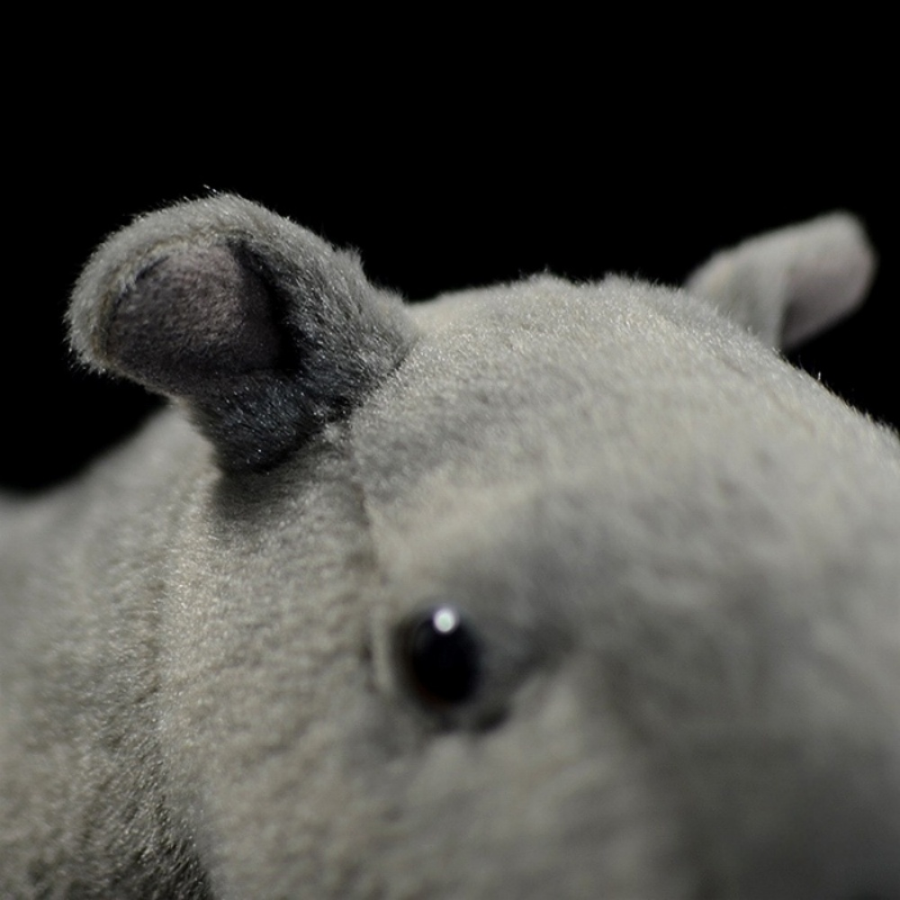 Zoomed-in view of Paraceratherium plush toy’s ears and eye, crafted with attention to detail