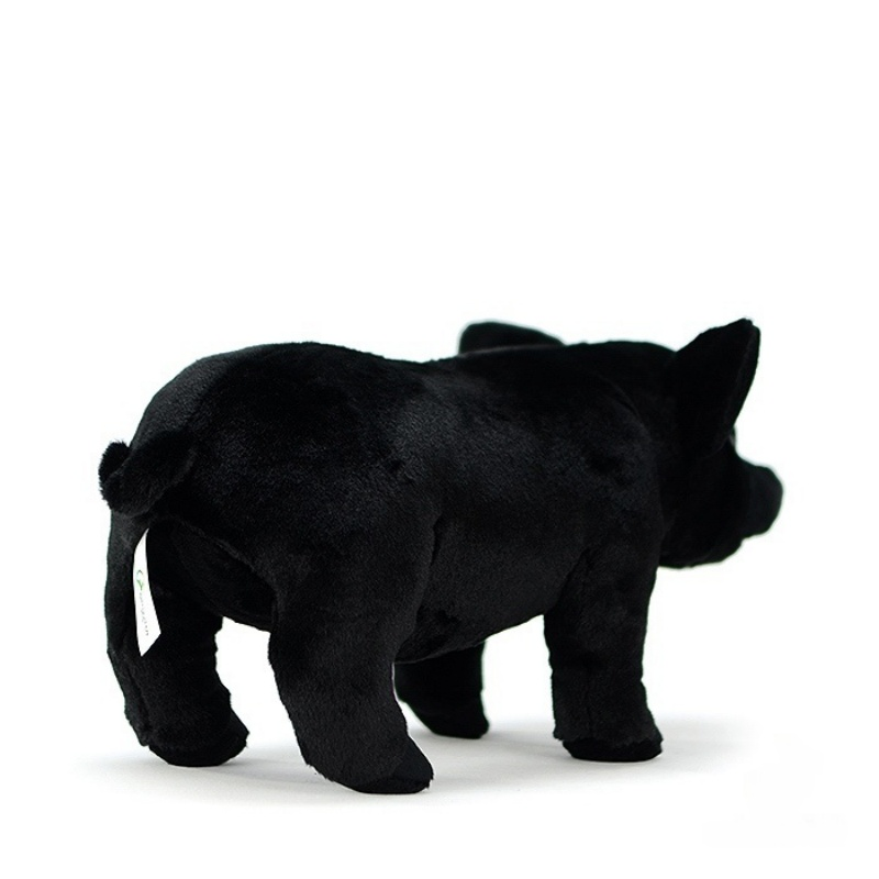 Rear view of a black pig plush toy, showcasing its realistic curled tail and soft texture