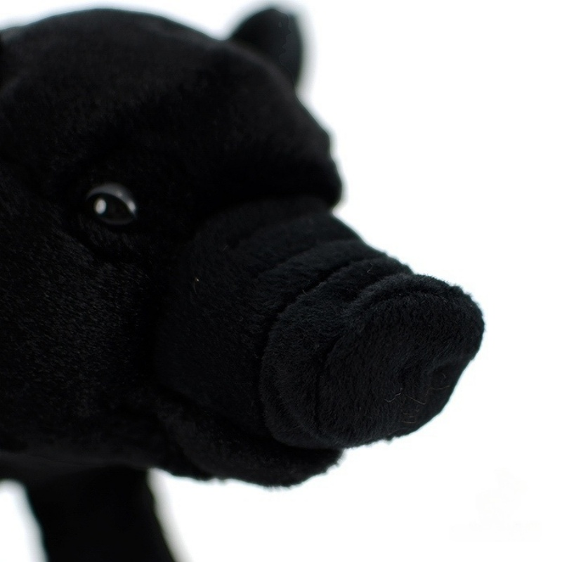 Close-up of black pig plush toy’s snout, emphasizing its realistic texture and adorable design
