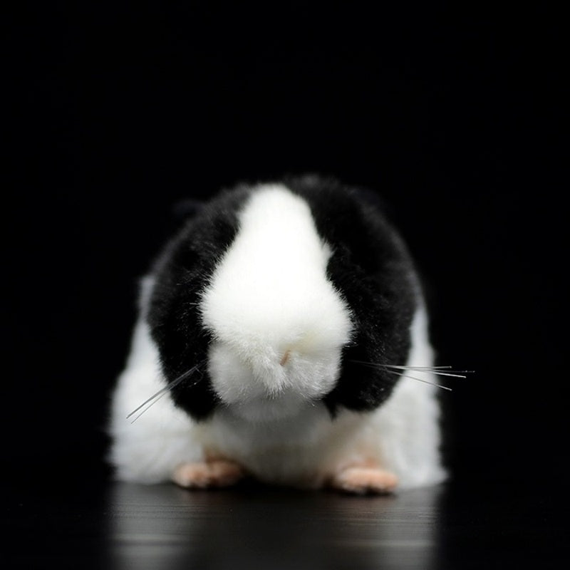 Front view of a black and white guinea pig plush toy showcasing its lifelike design and fluffy texture by SoftDaysLab