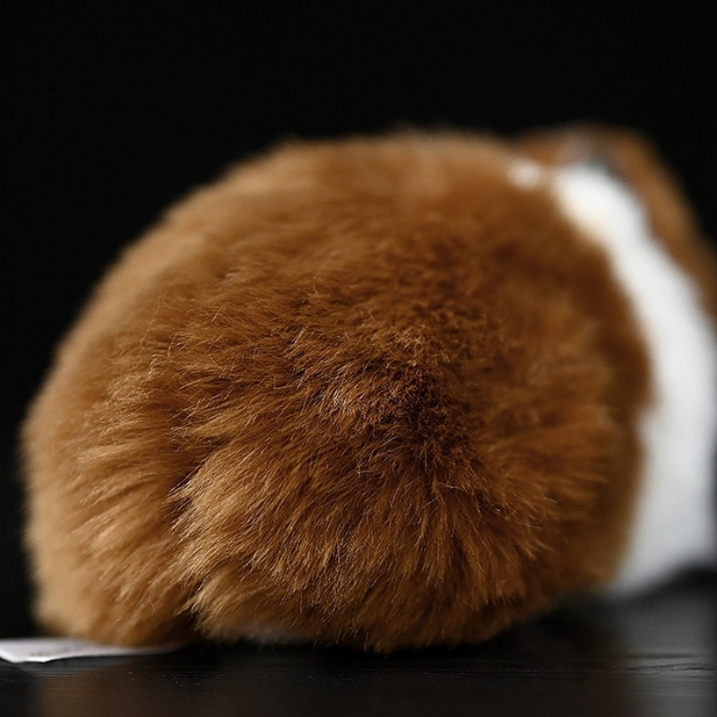 Rear close-up of a brown and white guinea pig plush toy, showcasing its soft and fluffy texture by SoftDaysLab