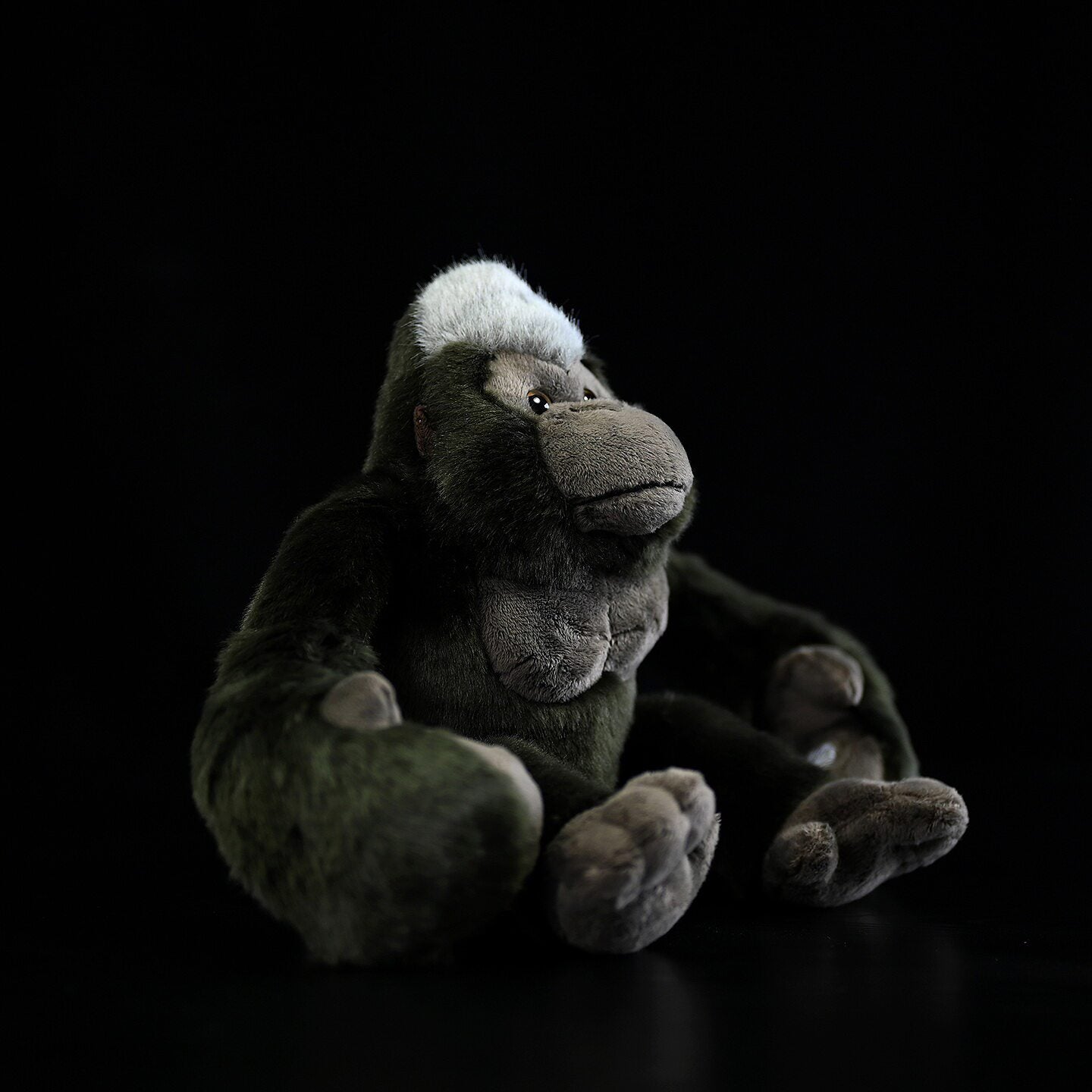 Side view of the adorable and realistic Hanging Silverback Gorilla plush toy for kids and collectors