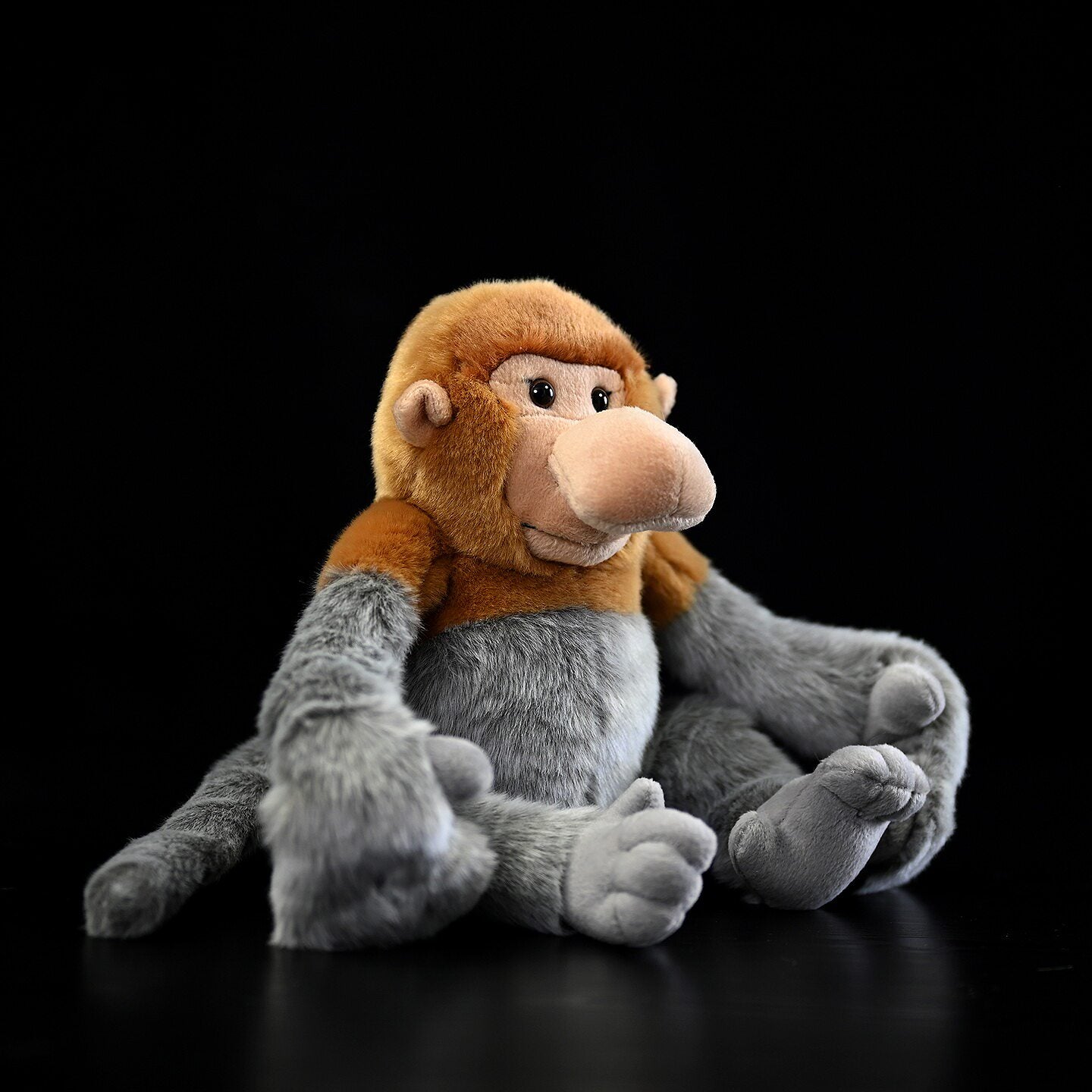 Sitting Proboscis Monkey plush with realistic soft fur and cute long nose, perfect for collectors