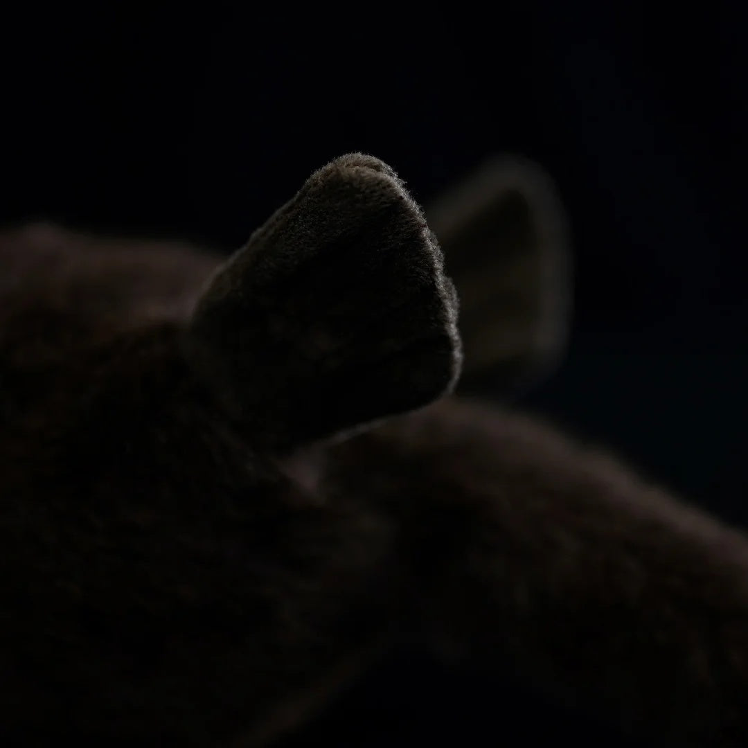 Close-up of lifelike SoftDaysLab® otter plush’s feet, showcasing soft fabric and careful stitching
