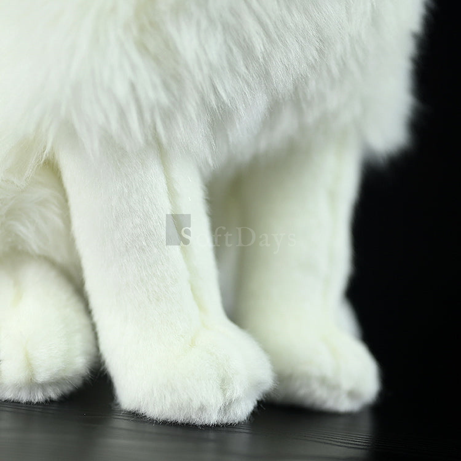 Close-up of the paws of the Samoyed dog plush toy, showcasing its soft white fur and realistic detail by SoftDaysLab