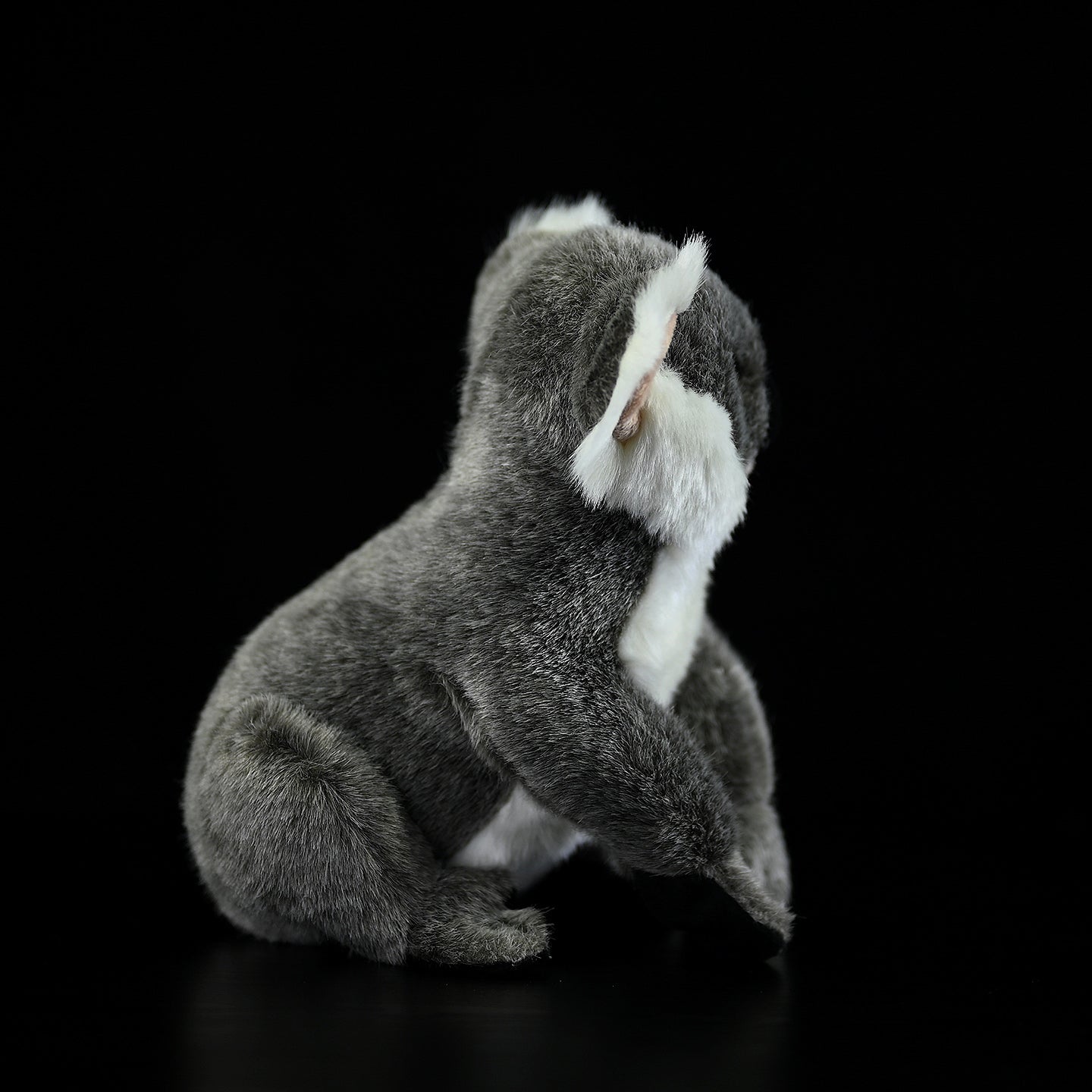 Back view of a koala plush toy, showcasing its soft gray fur and detailed craftsmanship