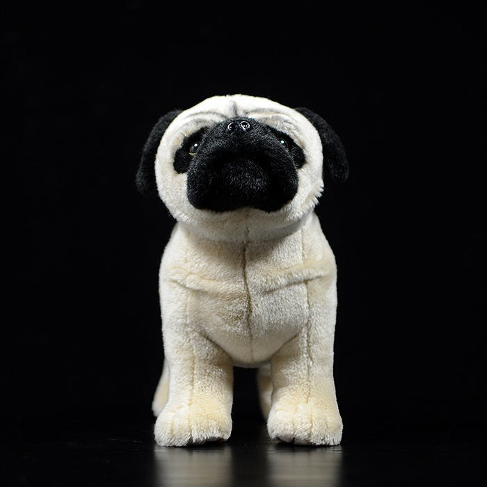 Front view of a fawn pug stuffed animal, showcasing its detailed face and soft beige fur
