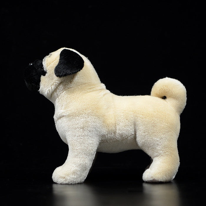 Side profile of a fawn pug plush toy with a curled tail and smooth, realistic design