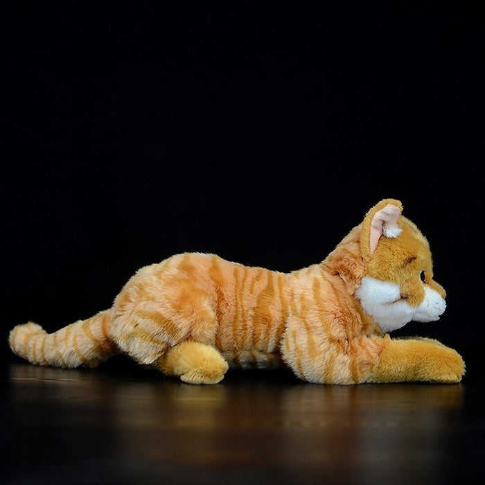 Side profile of a soft orange tabby cat plush toy in a lying pose, showcasing lifelike details
