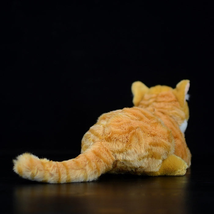 Back view of an adorable lying orange tabby cat plush, featuring realistic fur patterns and a fluffy tail