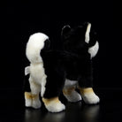Back view of a Black & Tan Shiba Inu plush toy, featuring its fluffy tail and soft fur texture