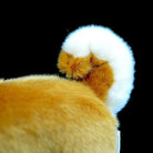 Close-up of Shiba Inu plush toy’s fluffy curled tail, designed to mimic the real dog’s charm