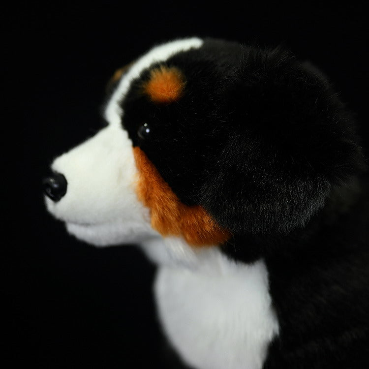 Side close-up of a Bernese Mountain Dog plush, featuring its soft fur and vibrant rust and white markings