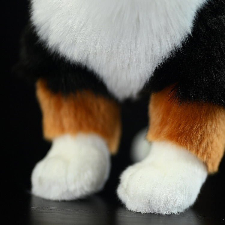 Detailed front paw view of the Bernese Mountain Dog plush toy, emphasizing its lifelike fur and texture