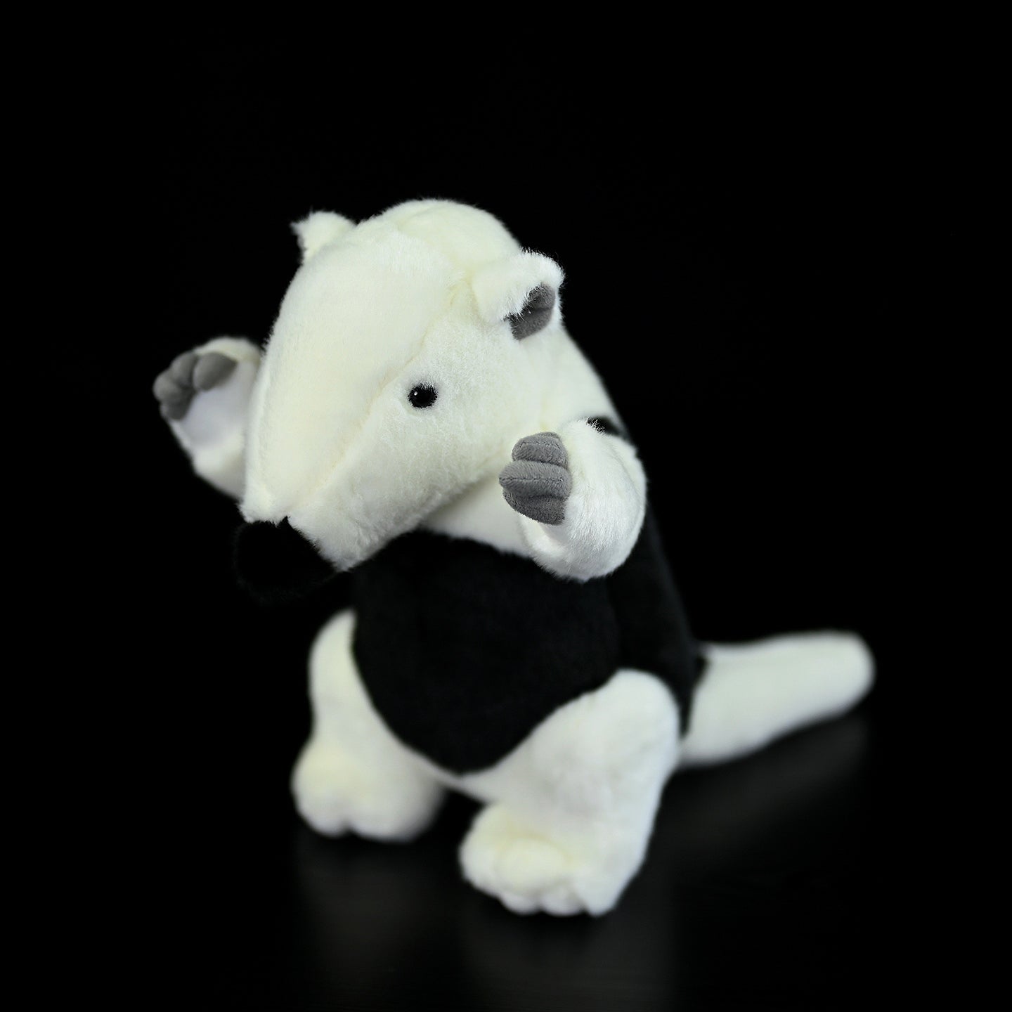 Angled view of a Southern Tamandua plush toy, highlighting its adorable face and lifelike features