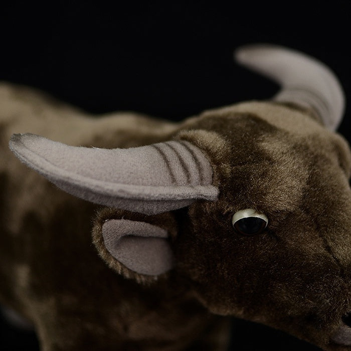 Detailed close-up of water buffalo plush toy’s horns and ears, showcasing lifelike craftsmanship