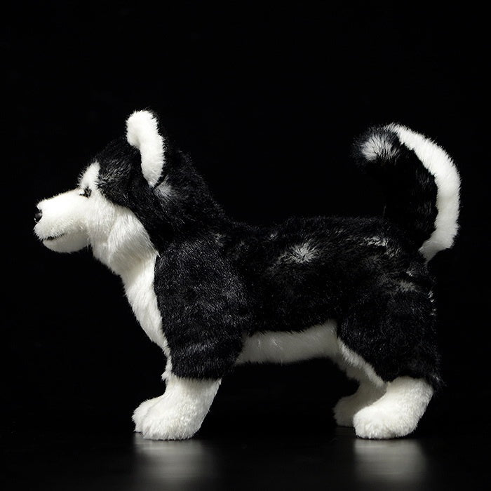 Side view of a realistic Siberian Husky plush toy, showcasing its soft fur and detailed features