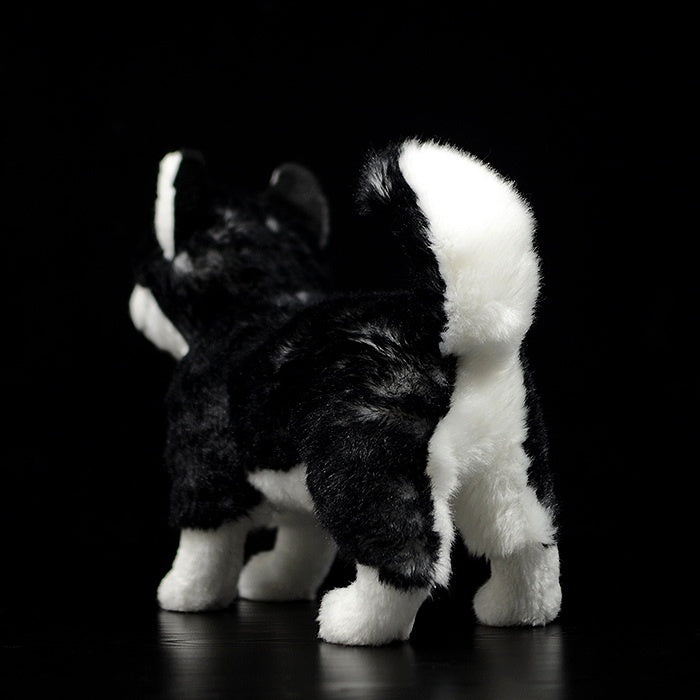 Back view of a Siberian Husky plush toy, highlighting its fluffy tail and soft fur texture