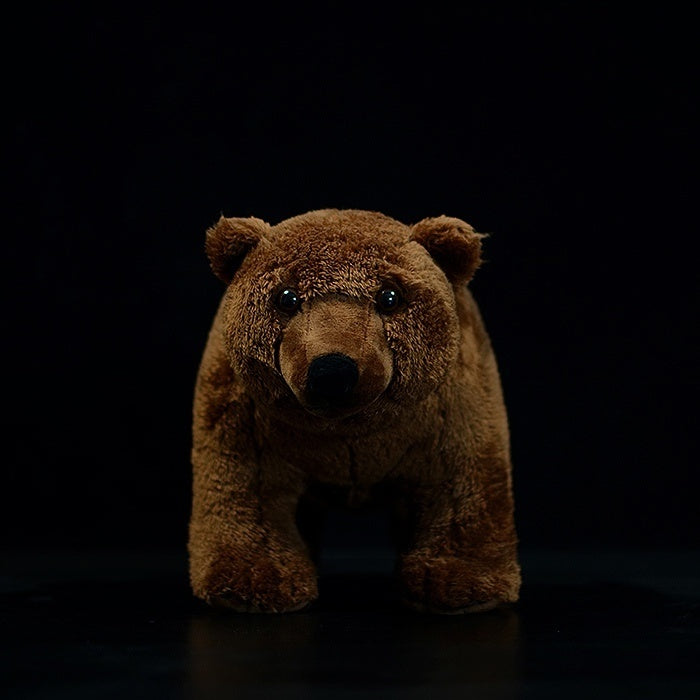 Front view of a brown bear plush toy standing upright, highlighting its lifelike appearance