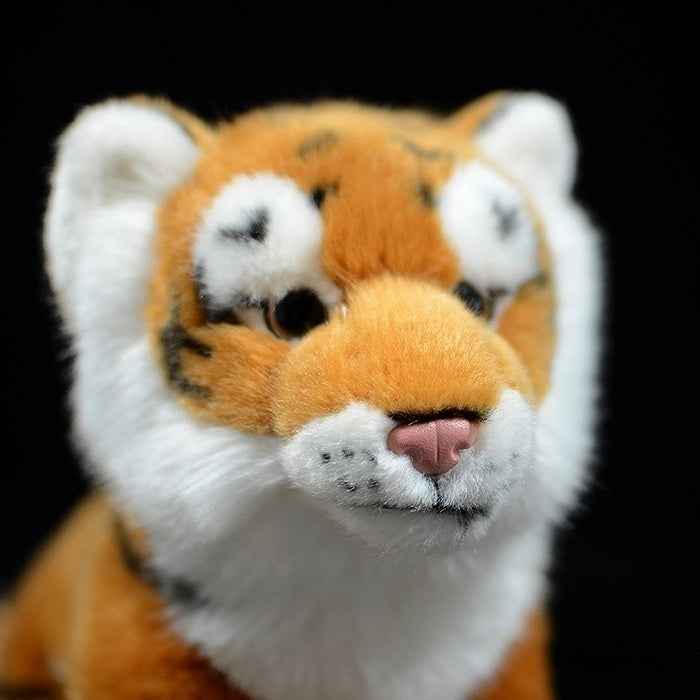 Close-up of a tiger plush face showing soft fur and lifelike features, perfect for tiger admirers
