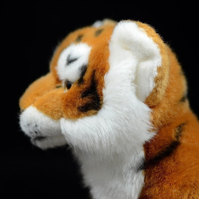 Close-up of a tiger plush face showing soft fur and lifelike features, perfect for tiger admirers