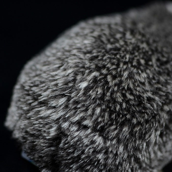 Close-up of the hedgehog plush toy's textured back, resembling real hedgehog spines