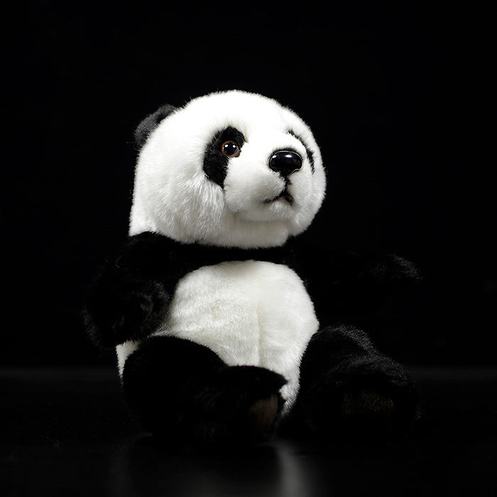 Lifelike giant panda plush toy by SoftDaysLab, sitting on a black background with iconic black-and-white fur