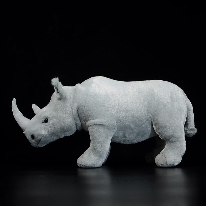 Side profile of SoftDaysLab white rhinoceros plush toy, highlighting its realistic shape and sturdy design