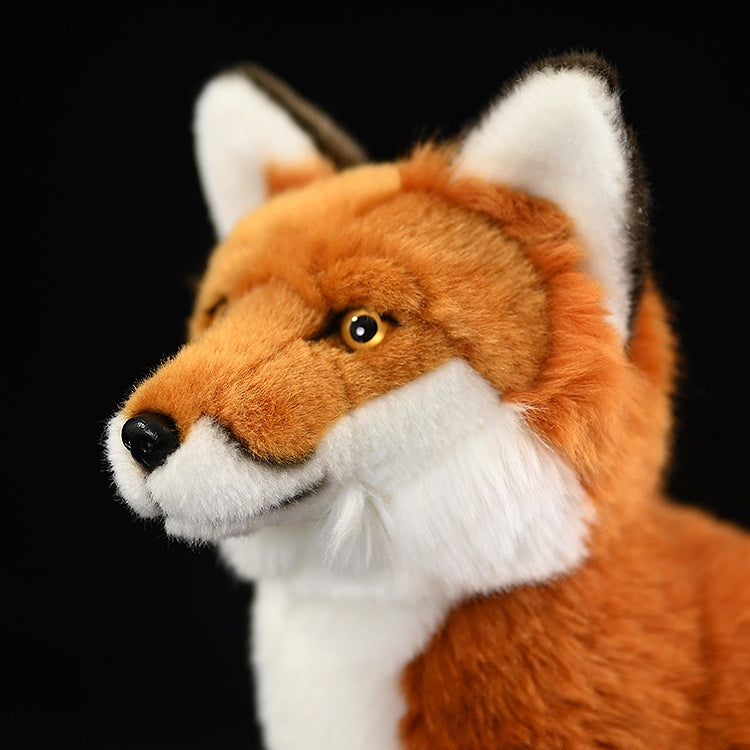 Close-up front view of a red fox plush toy, highlighting its realistic eyes, nose, and fluffy white cheeks for a lifelike look