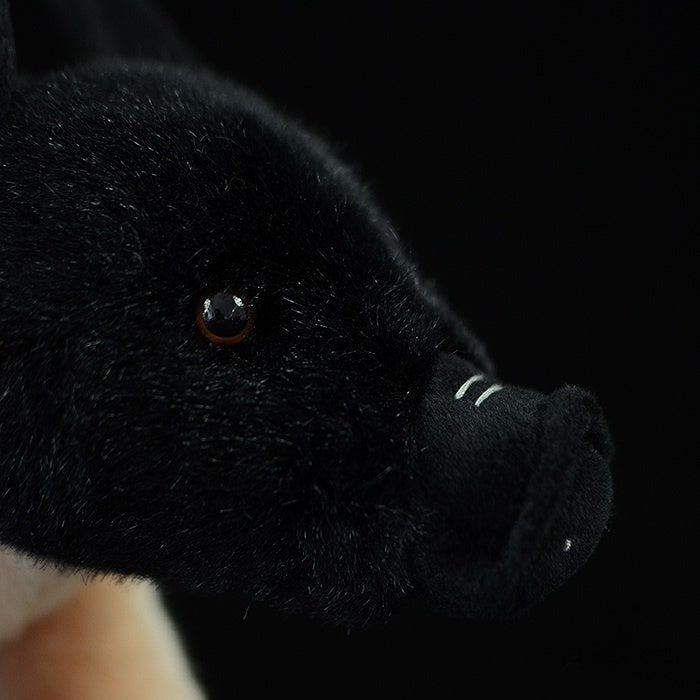 Close-up of plush pig's face, highlighting the realistic snout and soft black fur by SoftDaysLab