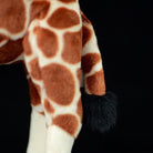 Tail detail of a giraffe plush toy with realistic fur and high-quality craftsmanship