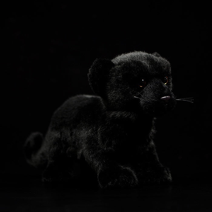 Side view of a lifelike black panther cub plush with soft fur, perfect for wildlife enthusiasts by SoftDaysLab