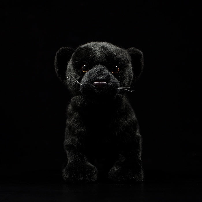 Front view of a realistic black panther stuffed animal with detailed fur and bright eyes for animal lovers