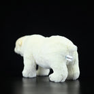 Back view of a polar bear plush toy highlighting its fluffy tail and soft, realistic texture