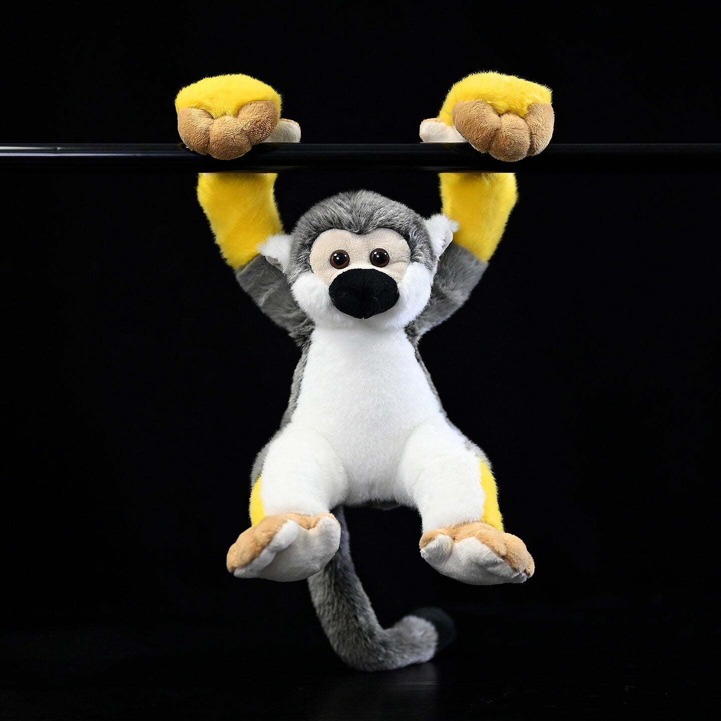 Hanging Common Squirrel Monkey plush with lifelike details and yellow accents by SoftDaysLab