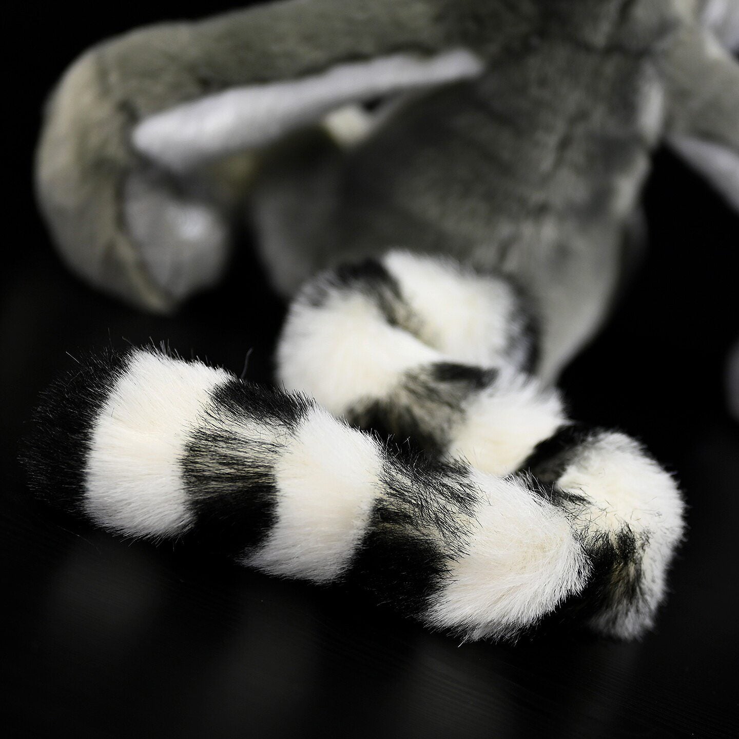 Detailed shot of the long, soft stripey tail of the Ring-tailed Lemur plush for realism