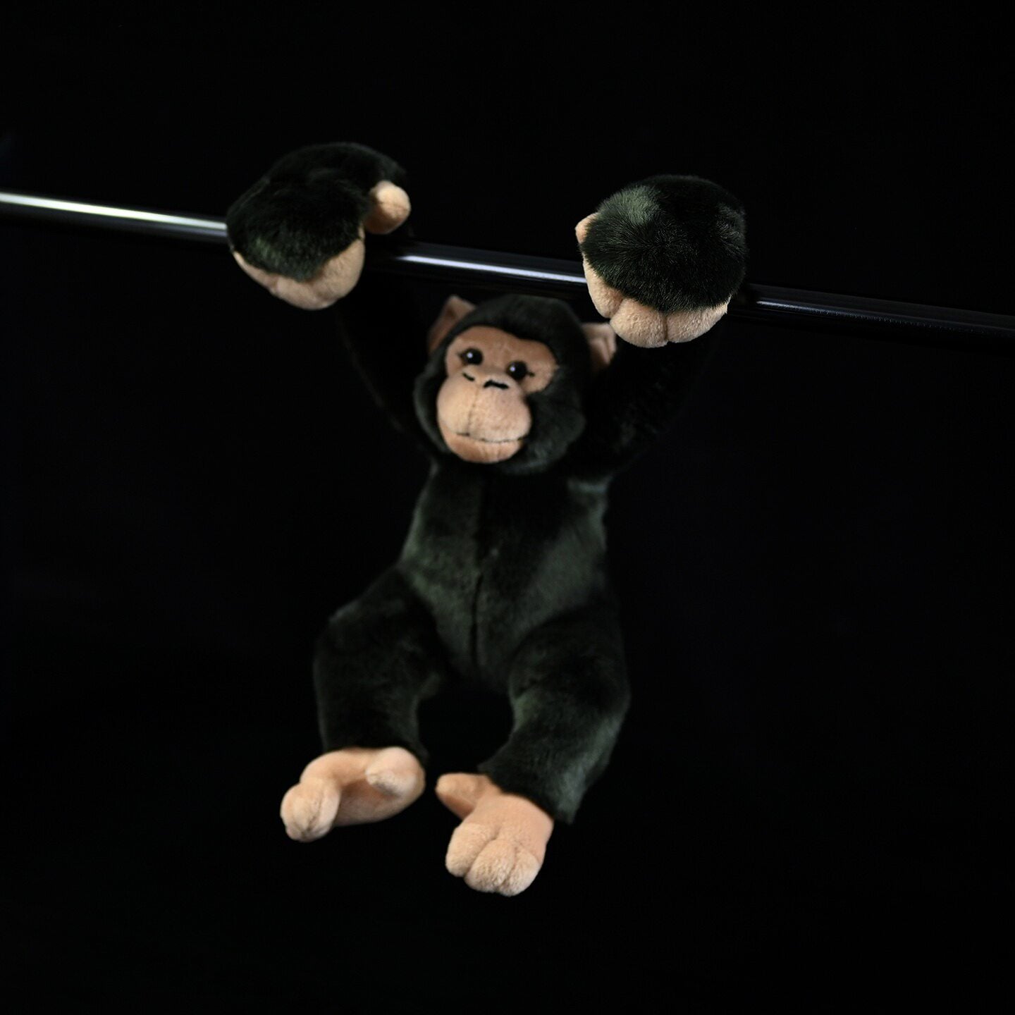 Hanging chimpanzee plush toy with fluffy arms, fun design, and adorable features for kids and collectors