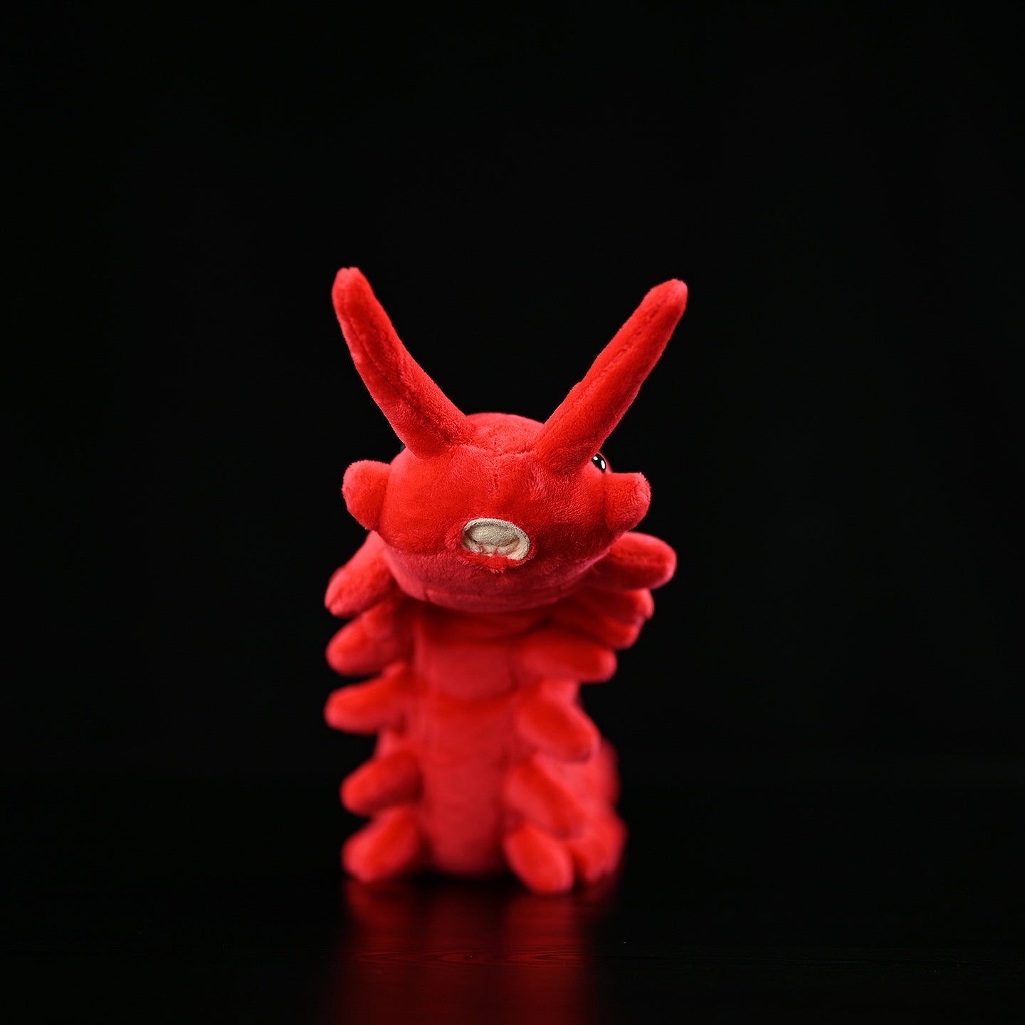 Front view of a realistic red velvet worm plush toy with lifelike antennae and soft texture by SoftDaysLab