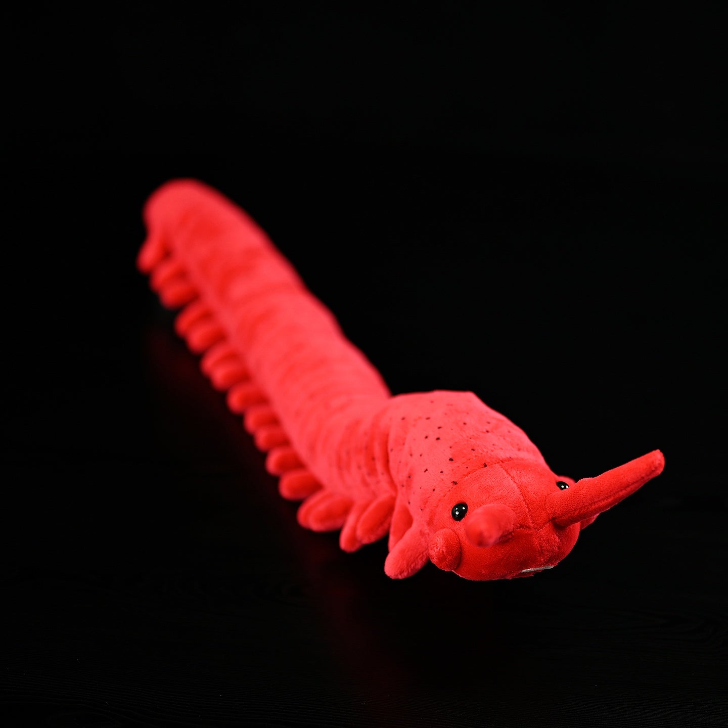Top-down view of the velvet worm plush toy, showcasing its detailed head and antennae by SoftDaysLab