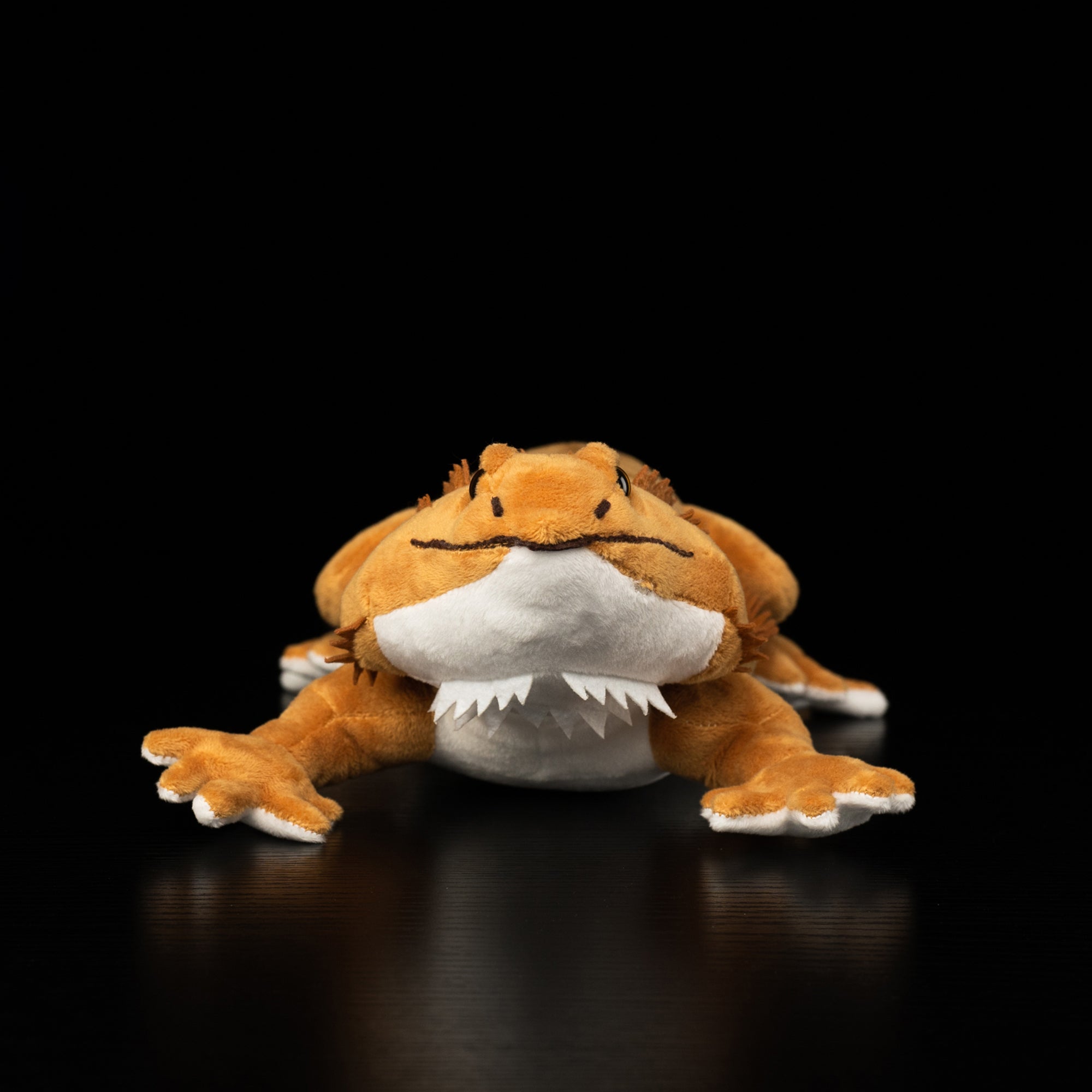 Front view of lifelike bearded dragon plush toy showing realistic face details and cute design by SoftDaysLab