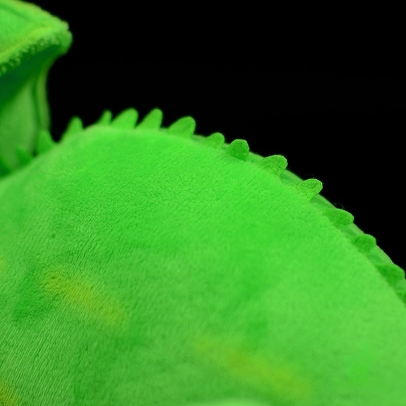 Focused view of the green chameleon's soft dorsal frill, crafted with plush fabric and vibrant colors